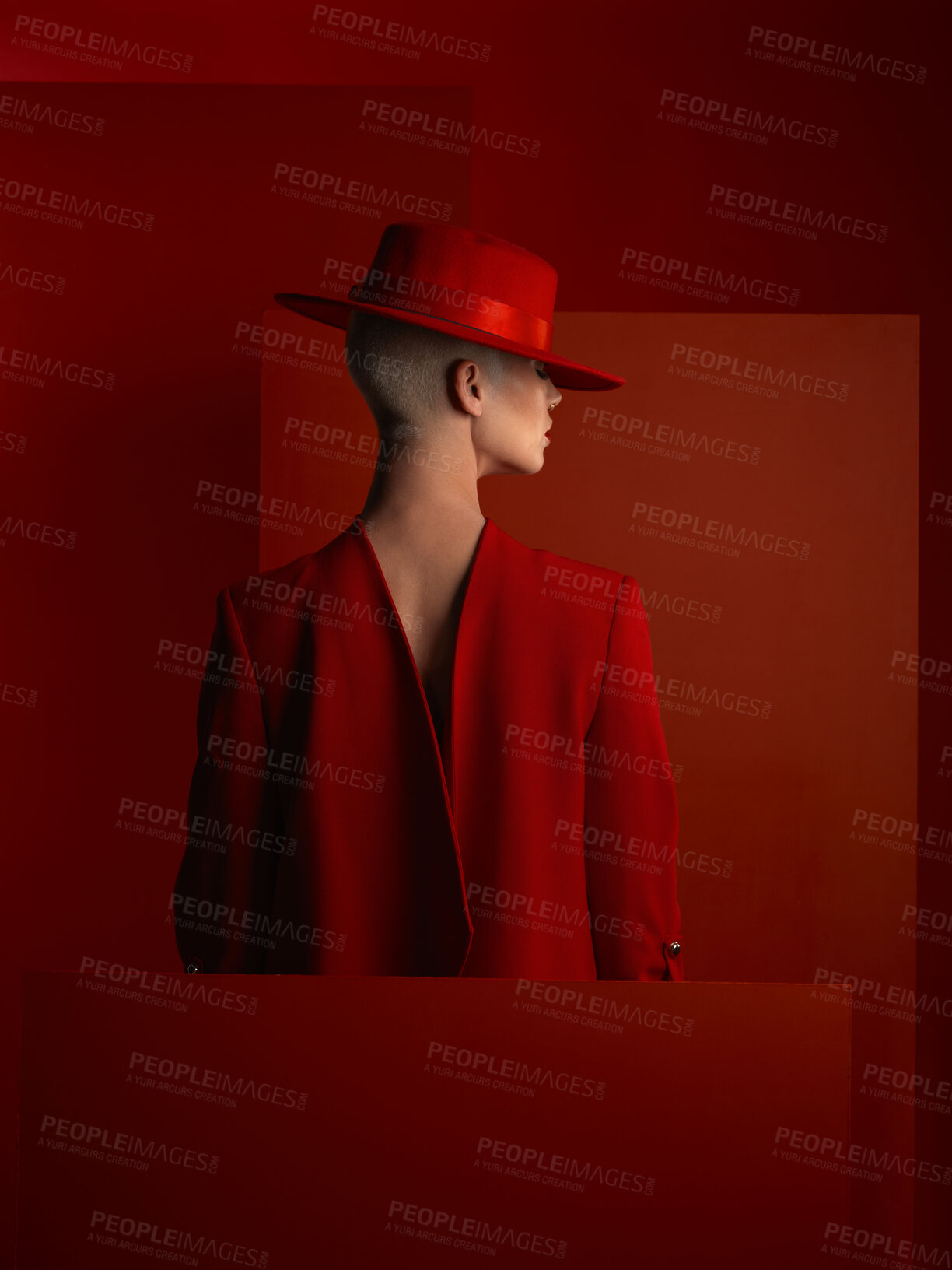 Buy stock photo Back, fashion and mockup with a woman on a red background in studio for marketing, advertising or branding. Hat, aesthetic style or a trendy young female person standing with an empty or blank poster