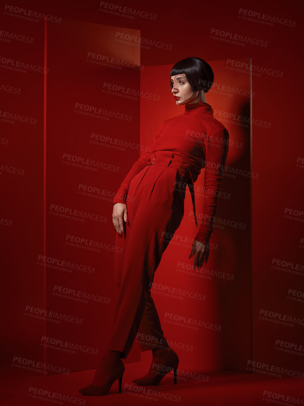 Buy stock photo Fashion, posing and a woman on a red background, thinking with a vision for style and aesthetic. Serious, idea and a retro model or girl in stylish clothes or a suit isolated on a studio backdrop