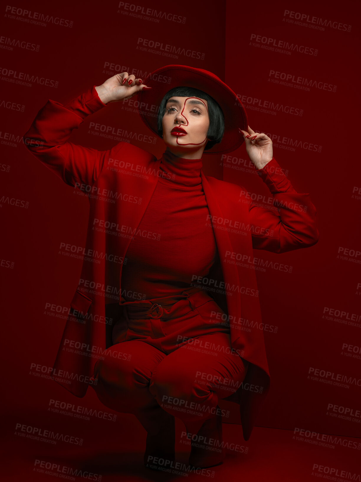Buy stock photo Woman, fashion and beauty with red aesthetic, makeup with art deco and vintage hat isolated on studio background. Retro style, female model with serious expression and cosmetics, attractive and bold
