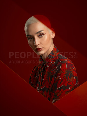 Buy stock photo Woman, fashion and portrait with red aesthetic, beauty and makeup with floral shirt isolated on studio background. Skin glow, female model with serious expression and cosmetics, attractive and bold