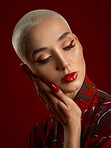Woman, beauty and red makeup with fashion and art deco, aesthetic and shine isolated on studio background. Female model, skin glow with bold cosmetics, young female model with glamour and creative