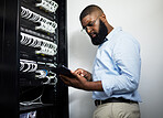 Data center, tablet and serious technician man with cables for internet connection for software programming. Engineer black person with tech for cybersecurity, wire or problem solving in server room