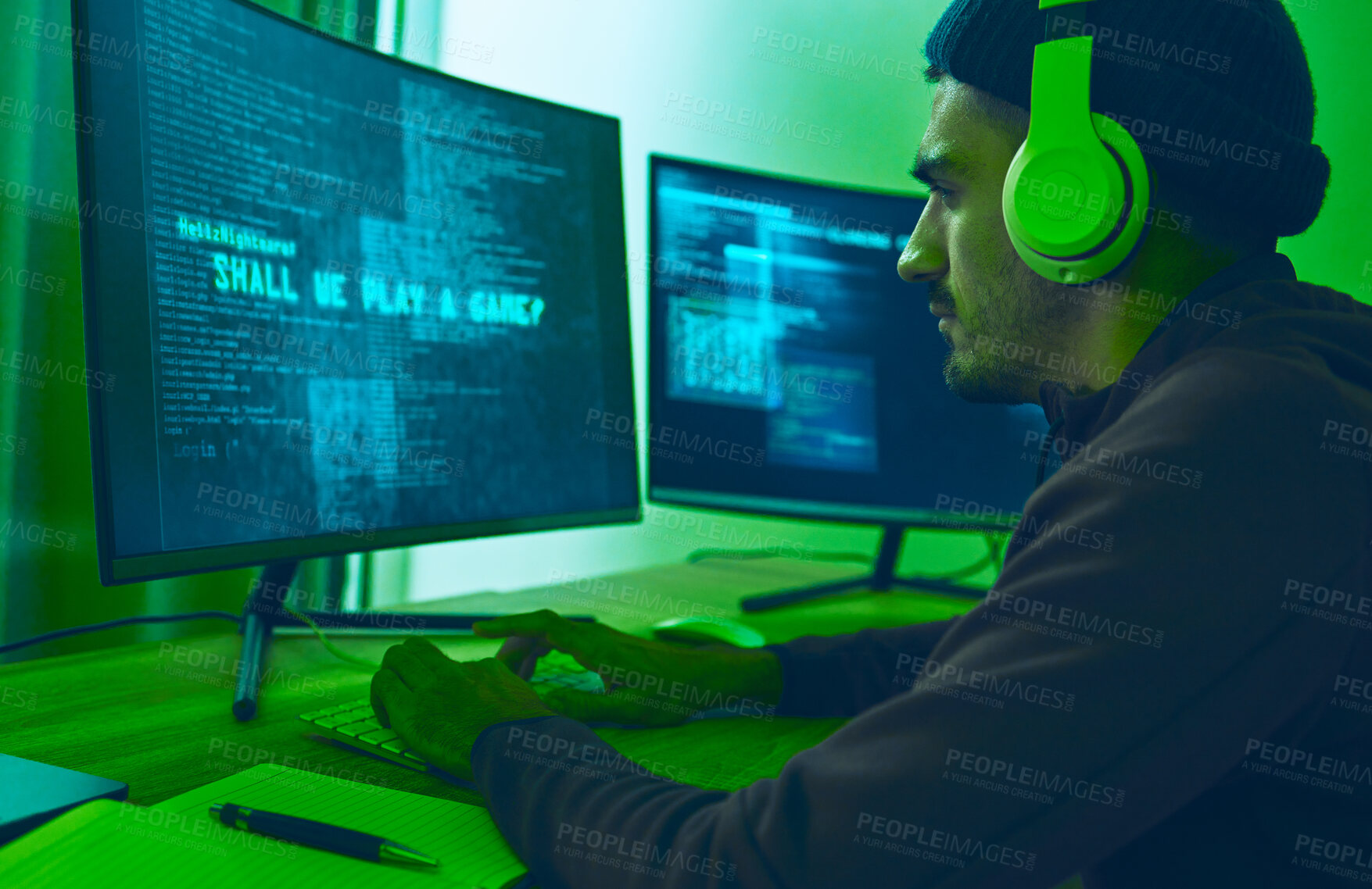 Buy stock photo Cyber, gaming and a man with a computer for hacking, streaming music or working on phishing. Serious, dark and a hacker or gamer with a website or information on a pc for a network or privacy