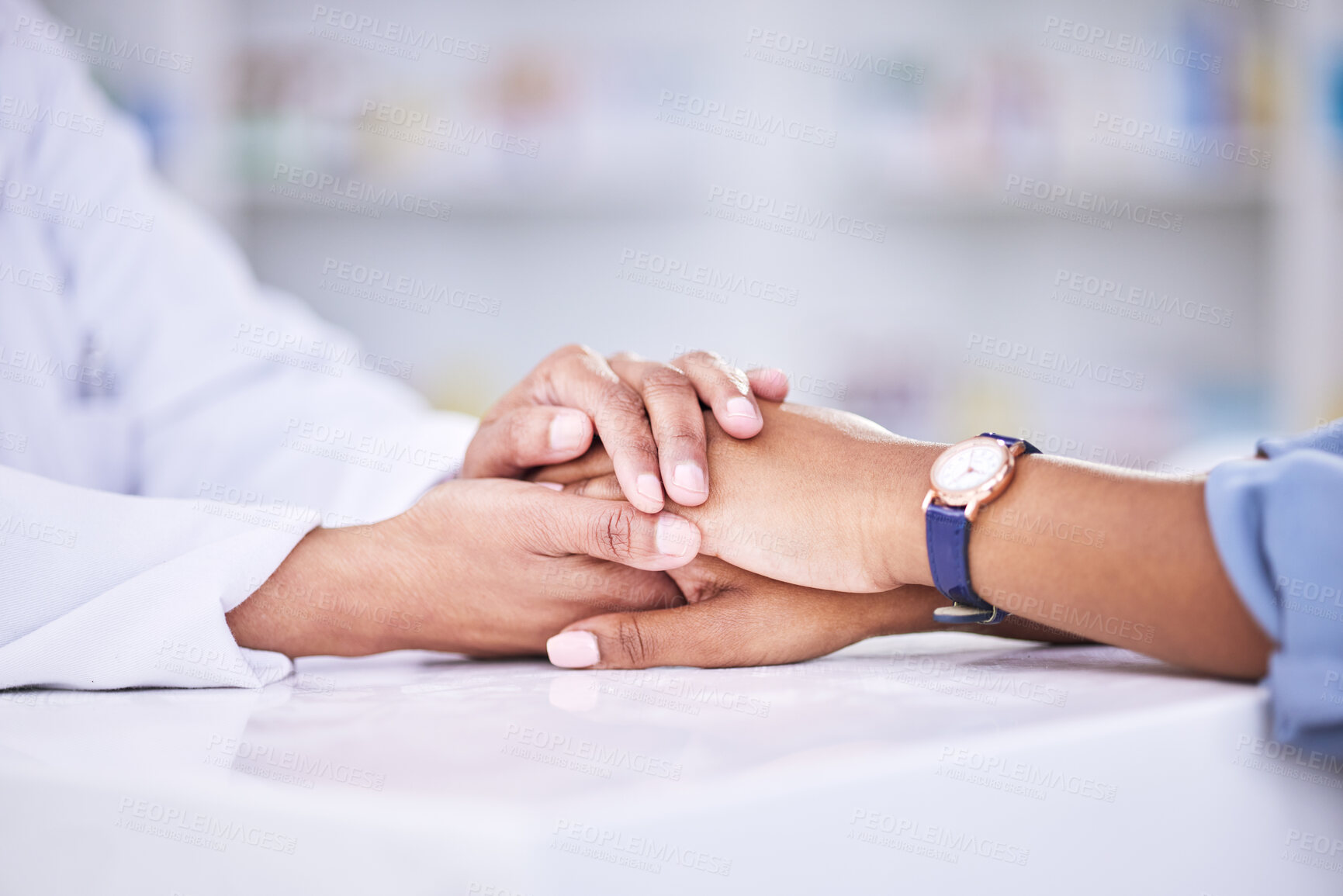 Buy stock photo Woman, pharmacist and holding hands for healthcare, support or trust on counter at the pharmacy. Closeup of female person or medical professional with patient in care for consultation, help or advice