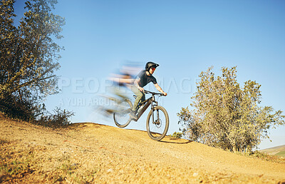 Buy stock photo Mountain bike, downhill and man outdoor in nature for extreme sports or fast training. Blur motion, speed and male person with courage or bicycle stunt for off road cycling, travel or adventure