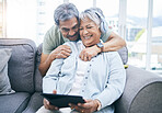 Happy, hug and couple with a tablet for a website, streaming music or a podcast together. Laughing, embrace and a senior man and woman with a movie or funny video on technology or listening to audio