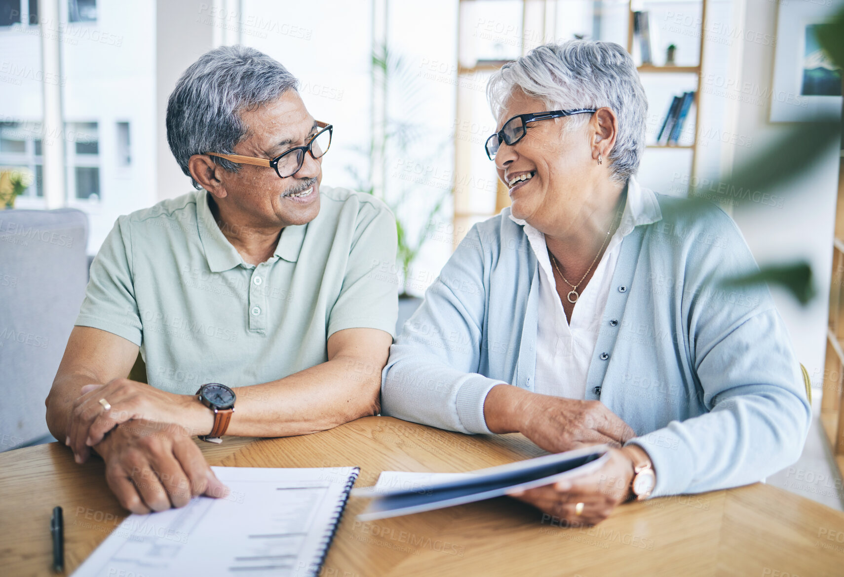 Buy stock photo Old couple, smile and financial planning with documents in home for pension, savings or tax. Elderly, man and happy woman with budget, investment and mortgage paperwork for insurance in retirement.