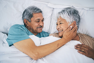 Buy stock photo Bed, love and happy senior couple in a bedroom bonding as care, support and relax to enjoy retirement in a home. Smile, solidarity and elderly people, man and woman with trust in marriage together