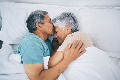 Buy stock photo Top view, hug and senior couple in bed, love and sleeping with retirement, wake up or happiness with a kiss. Romance, old man or elderly woman embrace, bedroom or holiday with marriage or loving