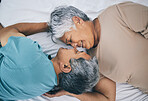 Bed, love and senior couple faces together in a bedroom bonding as care, playing and relax to enjoy retirement in a home. Happy, solidarity and elderly people, man and woman with trust in marriage