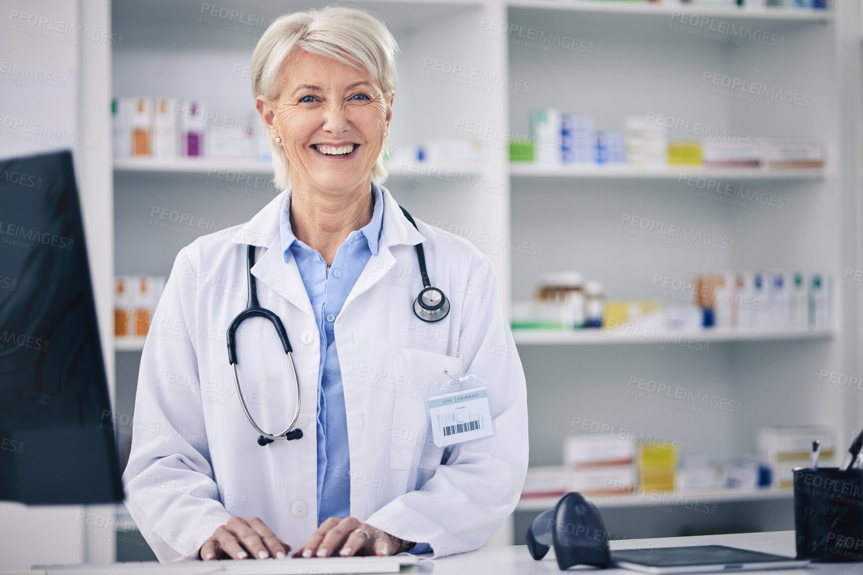 Buy stock photo Happy, portrait and a pharmacist typing on a computer for medical information, email or working. Smile, pharmacy and a mature woman with a pc at a clinic or medicine store to check for stock