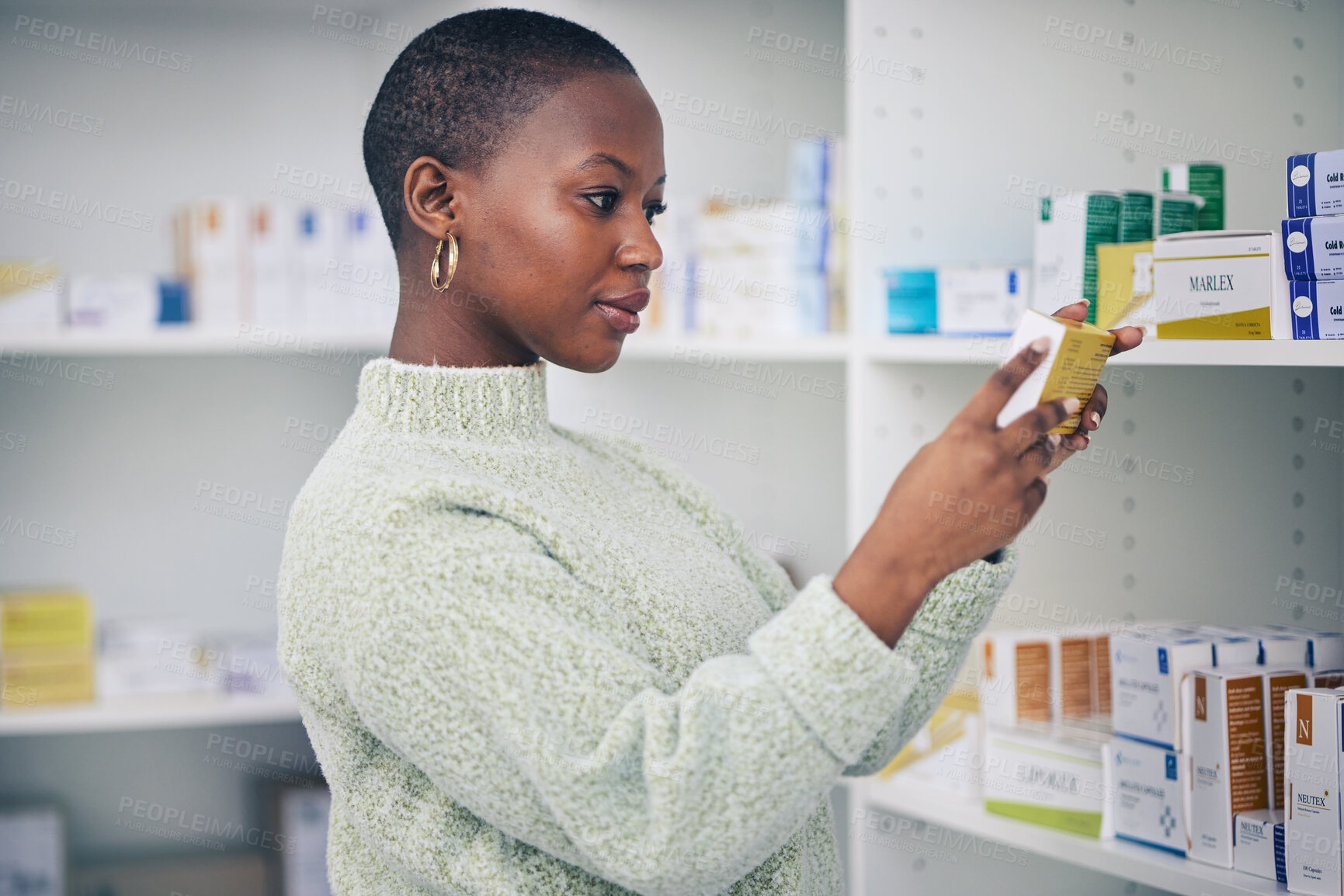 Buy stock photo Black woman, customer and box on shelf for medication, pills or medicine at the pharmacy. African female person or patient reading pharmaceutical products or drugs for healthcare cure at clinic store