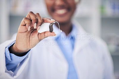 Buy stock photo Woman, pharmacist and hands with hearing aid holding listening device for healthcare at the pharmacy. Closeup of deaf person or medical professional with ear piece in audiology for sound at clinic