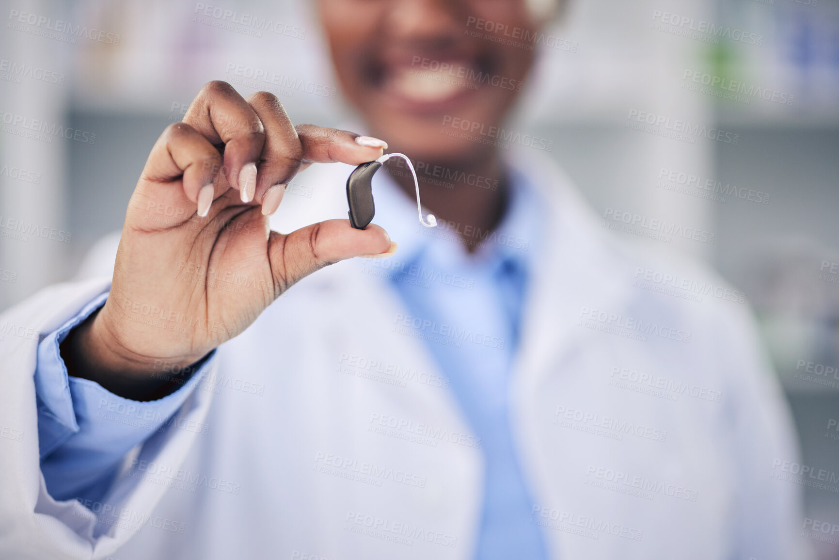 Buy stock photo Woman, pharmacist and hands with hearing aid holding listening device for healthcare at the pharmacy. Closeup of deaf person or medical professional with ear piece in audiology for sound at clinic