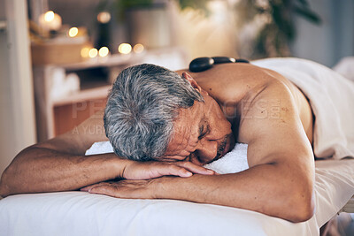 Buy stock photo Senior man, sleeping and relax in massage for spa treatment, body care and physical therapy at resort. Calm elderly male person relaxing or asleep on salon bed for zen, stress relief or getaway