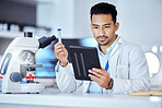 Science, tablet and man in laboratory with test tube for research, study and sample analysis. Healthcare, biotechnology and scientist online with medical equipment for vaccine, analytics and medicine