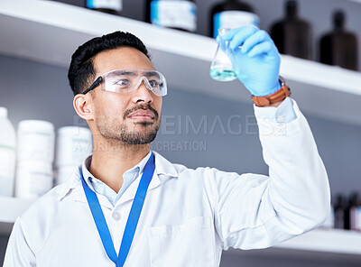 Buy stock photo Scientist, blue chemical in beaker and man in laboratory, medical research and science experiment with analysis. Male doctor, liquid solution and chemistry with scientific study, health and biotech