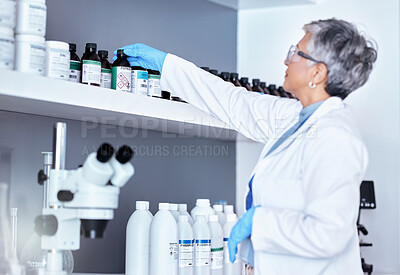 Buy stock photo Research, medical and a scientist with a chemical in a lab for healthcare innovation or analytics. Science, expert and a mature woman with medicine, working on pharmaceutical test and inspection