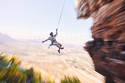 Buy stock photo Sports, rock climbing and jump with man on mountain for fitness, adventure and challenge. Rope, workout and hiking with person training on cliff in nature for travel, freedom and exercise mockup