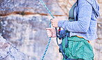Rock climbing, mountain and woman with rope for adventure, freedom and extreme sports outdoors. Fitness, nature and female person with safety equipment or gear for training, activity and challenge