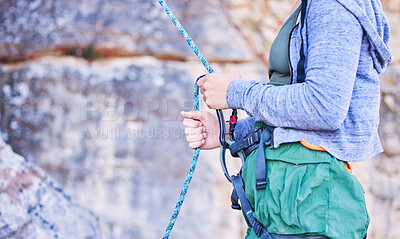 Buy stock photo Rock climbing, mountain and hands of woman with rope for adventure, freedom and extreme sports. Fitness, outdoor and female person with safety equipment or gear closeup for training and challenge