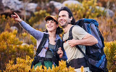 Buy stock photo Hiking, travel and couple pointing on mountain for adventure, holiday and sightseeing journey in nature. Happy, dating and excited man and woman walking to explore, trekking and backpacking outdoors
