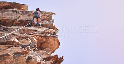 Buy stock photo Rock climbing, space and mountains with woman in nature for sports, banner and adventure. Fitness, exercise and travel with person training on cliff for rope, challenge and performance mockup