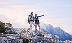 Mountain, trekking and view, man with woman on peak for adventure in nature, landscape and travel. Outdoor trekking, couple on cliff and relax in scenic clouds for natural journey, pointing at sky.