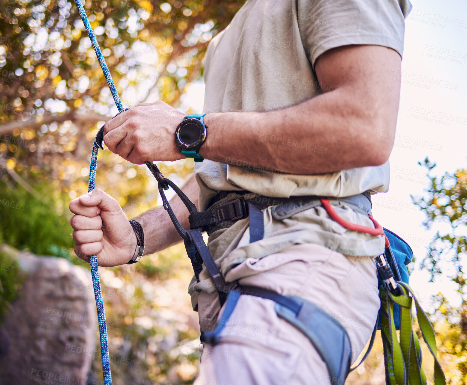 Buy stock photo Rock climbing, mountain and man with rope and harness for adventure, freedom and extreme sports in nature. Fitness, hiking and male person with equipment or gear for training, activity and challenge