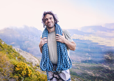 Buy stock photo Portrait, mountain climbing and rope with a man hiking in the wilderness for adventure or to explore nature. Smile, fitness and sports with a happy young male athlete outdoor for a training challenge