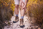 Hiking, leg pain and shoes of man in nature for injury, training and accident. Emergency, healthcare and inflammation with closeup of person walking on path for muscle, trekking and problem
