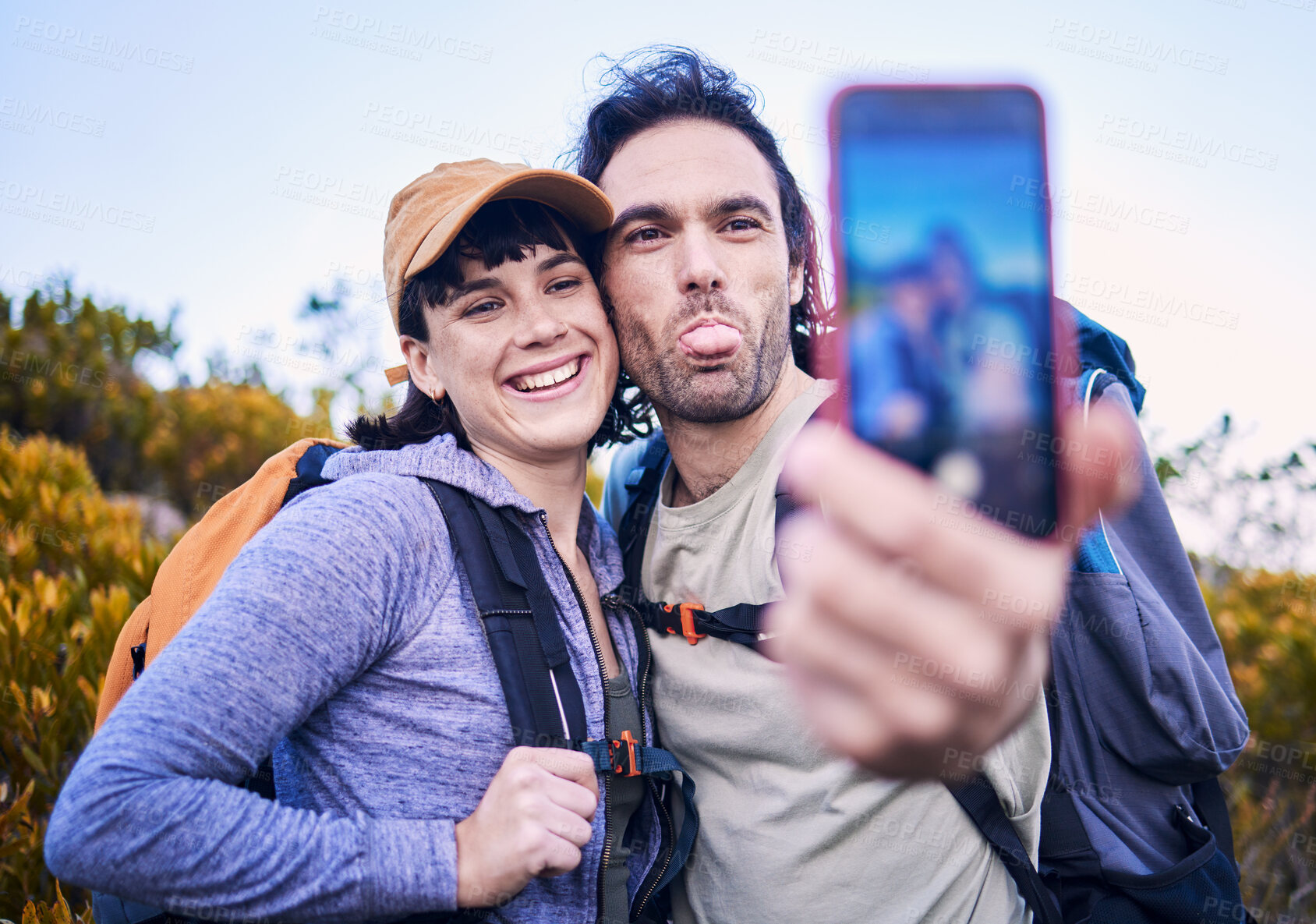 Buy stock photo Hiking, silly selfie and couple on mountain for adventure, holiday and journey on mountain. Travel, dating and happy man and woman take goofy picture for memories, trekking and backpacking outdoors