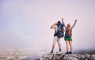 Buy stock photo Mountains, hiking and man with woman on cliff for adventure in nature, landscape and travel. Outdoor trekking, couple on peak and relax in view of clouds on natural journey, celebration and arms up.