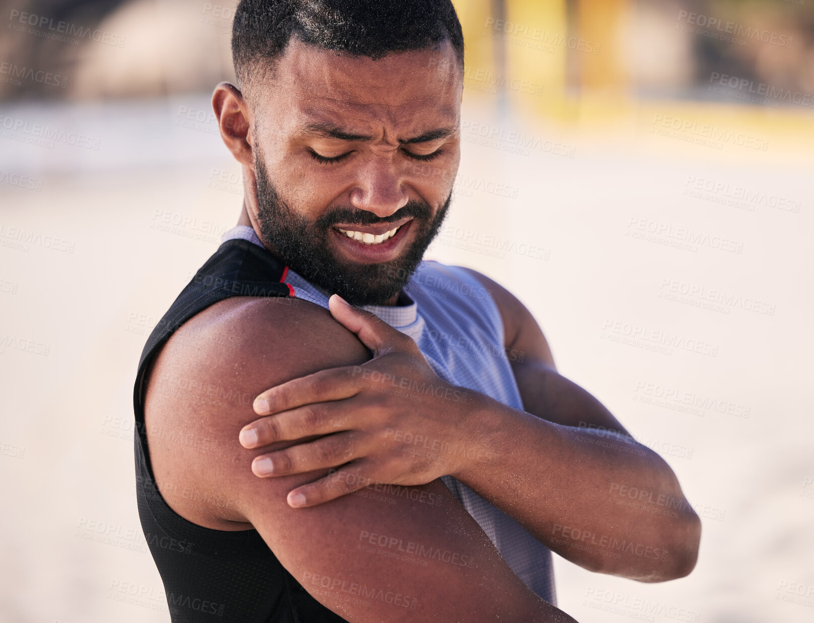 Buy stock photo Arm pain, sports and man at a beach for volleyball, fitness and performance training with problem. Shoulder, injury and male player with arthritis, fibromyalgia or osteoporosis crisis during workout 