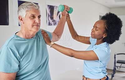 Buy stock photo Senior man, physiotherapy and dumbbells with black woman for help in clinic workout for wellness. Nurse, physical therapist, patient and support with equipment for rehabilitation in nursing home.