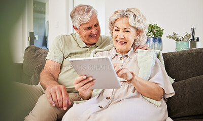 Buy stock photo Senior couple, tablet and smile on sofa in home living room for news app, movies or streaming internet show. Happy woman, elderly man and digital technology for social media, reading ebook or website