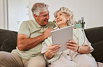 Happy senior couple, tablet and sofa to download news app, reading social media post and ebook. Elderly man, woman and digital technology to scroll website, internet and online shopping in retirement