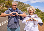 Senior couple, heart hands and fitness outdoor on road, love icon and portrait with smile, workout or health. Mature woman, man and happy with sign, emoji or symbol for exercise in retirement on hill