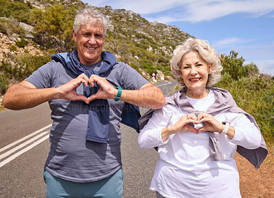 Buy stock photo Senior couple, heart hands and fitness outdoor on road, love icon and portrait with smile, workout or health. Mature woman, man and happy with sign, emoji or symbol for exercise in retirement on hill