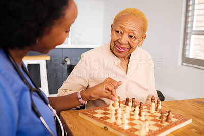 Buy stock photo Nurse playing chess with a senior patient after a healthcare consultation in nursing rehabilitation center. Board game, conversation and female caregiver bonding with elderly woman in retirement home