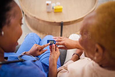 Buy stock photo Oximeter, finger and woman with nurse in nursing home, healthcare service and support above. Blood oxygen test, pulse monitor and patient, people or african doctor helping with medical exam on sofa