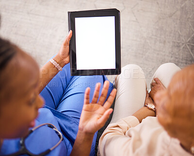 Buy stock photo Nurse, caregiver and tablet mockup with patient above for consultation or healthcare advice at the home. Hands of doctor in elderly care consulting senior female person on technology display in house