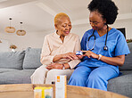 Diabetes, monitor and senior woman with nurse in nursing home in healthcare service and support. Blood pressure, hypertension test and elderly patient in retirement and medical african doctor on sofa