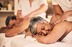 Relax, retirement and a couple at the spa for a massage together for peace, wellness or bonding. Luxury, beauty or body care with a senior woman and man in a beauty salon for physical therapy