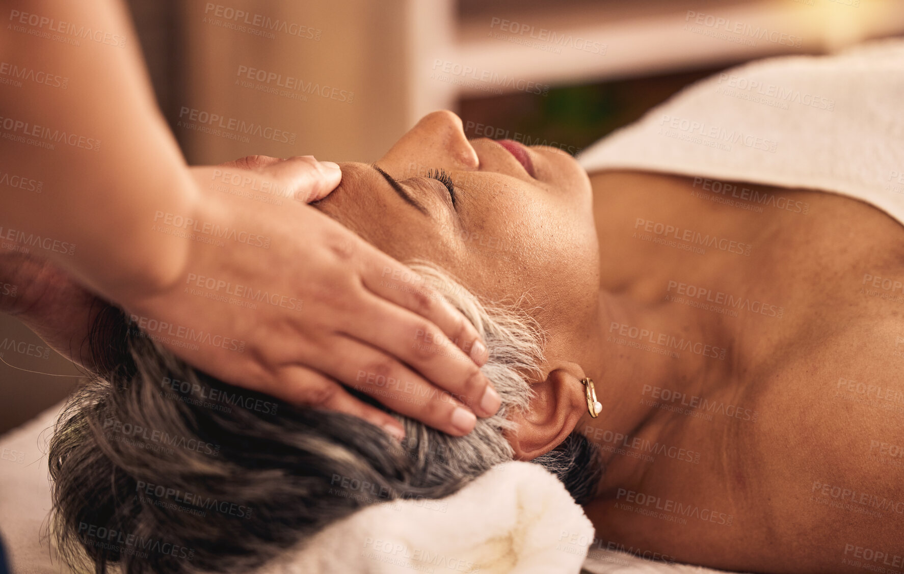 Buy stock photo Woman, facial and head massage at spa for beauty, skincare treatment and healing at cosmetics salon. Face of calm mature female client relax at wellness resort for reiki, acupressure and zen therapy