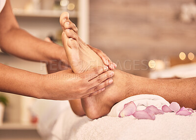 Closeup, feet and spa with a massage, relax and skincare with wellness, calm and stress relief. Zoom, barefoot and client with luxury, health or treatment with grooming, cosmetic service or self care