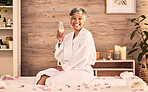 Spa, champagne and happy woman in portrait for facial, massage and holiday celebration or self care. Excited, wine glass and senior person luxury, wellness and relax with hospitality service or hotel