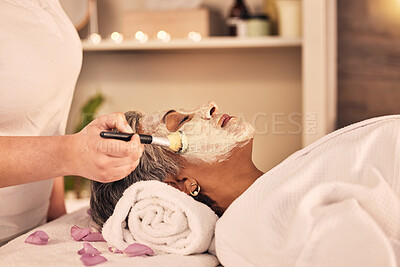 Buy stock photo Woman, relax and brush face mask at spa, skincare treatment and zen therapy in beauty salon. Calm mature female person at wellness resort for facial cleaning, hydration cosmetics and dermatology glow