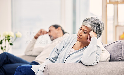 Buy stock photo Senior couple, divorce and fight on sofa in conflict, argument or disagreement in living room at home. Elderly man and woman in stress, depression or toxic relationship for cheating affair or breakup