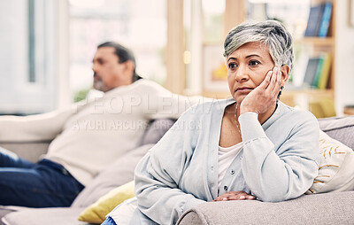 Buy stock photo Senior couple, divorce and fight in conflict, argument or disagreement on living room sofa at home. Elderly man and woman in stress, depression or toxic relationship for cheating affair or breakup